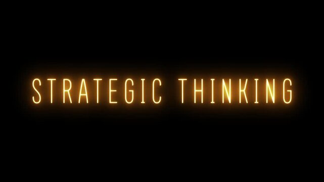 Illuminated orange neon sign spelling STRATEGICTHINKING in uppercase letters, glowing against a black background, symbolizing intellect, planning, foresight, and intelligent