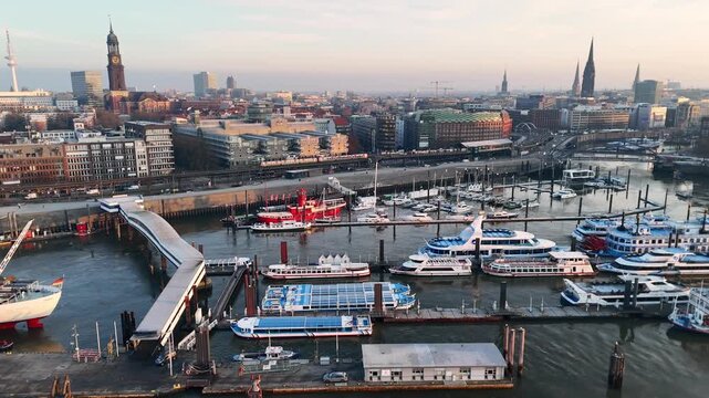 Hamburg Germany 2026 01 22: Aerial drone shot of boats in the harbor and the skyline of Hamburg at St. Pauli Landungsbr&uuml;cken