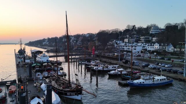 Hamburg Germany 2026 03 09: Aerial drone footage (ascent) of the museum harbor and waterfront in &Ouml;velg&ouml;nne in Hamburg at sunset