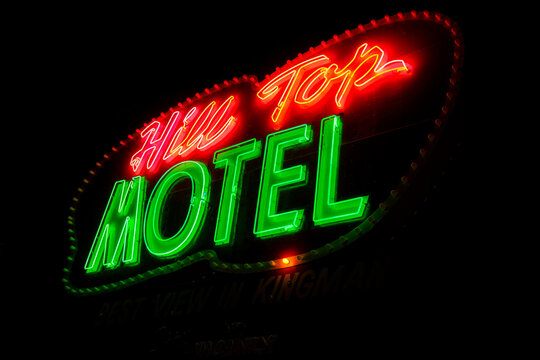 Kingman, Arizona - March 28, 2026: Neon sign for the Hill Top Motel, a mom and pop retro hotel along Route 66 in historic Kingman AZ. Taken at night