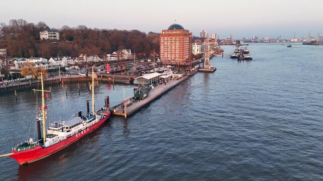 Hamburg Germany 2026 03 09: Aerial drone footage (orbiting) of the museum harbor and waterfront in &Ouml;velg&ouml;nne in Hamburg at sunset