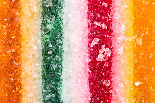 Striped fruit flavored marmalade coated with sugar in macro
