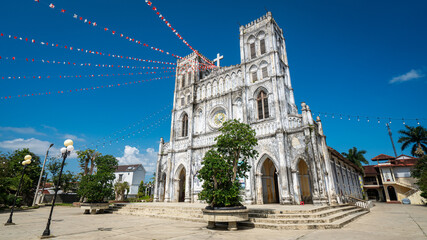 Wide Symmetrical Ground View of Mang Lang Church Forecourt and Ornate Gothic Facade Phu Yen Vietnam © jr