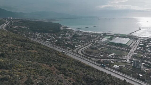 Aerial view of Iskenderun city coast, highway and Mediterranean sea in Hatay, Turkey - 4K
