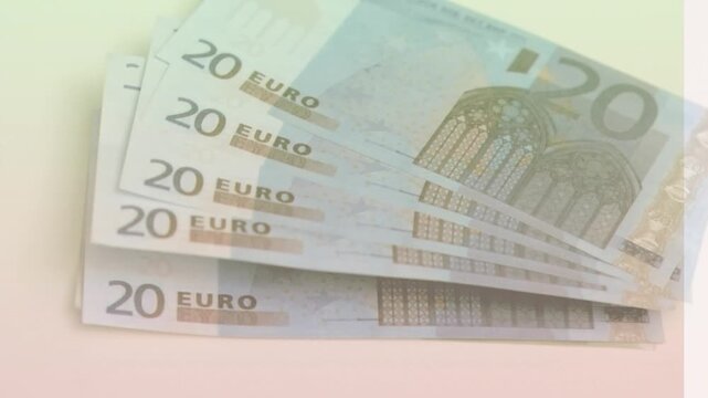 Animation of close up of euro bills flying against yellow gradient background