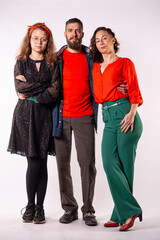 Fototapeta premium Stylish Family of Three Standing Together in Studio Portrait on White Background
