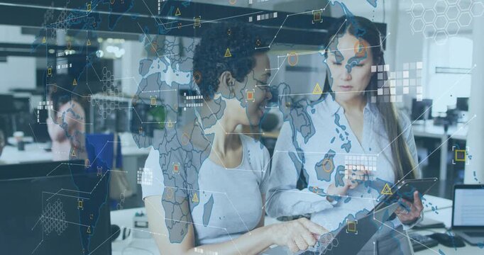 female analysts tapping keys and tracing tablet hotspot as map overlay fading in driving analytics