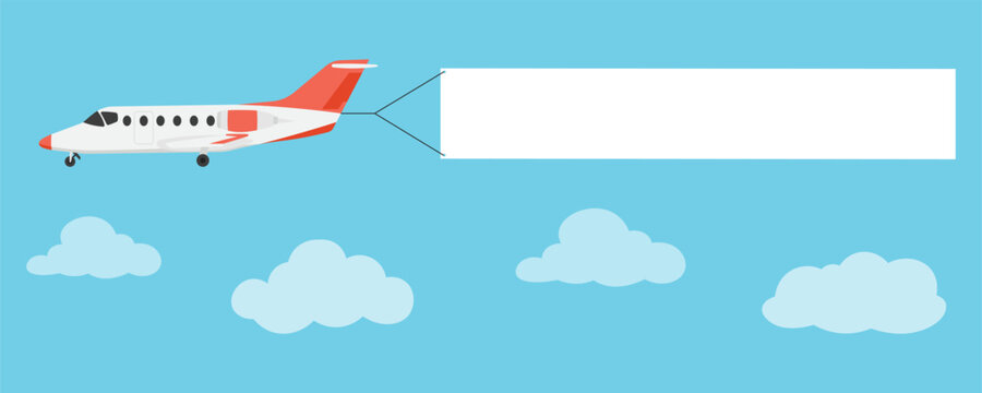 Private jet airplane flying in the blue sky with clouds and pulling a blank white rectangular banner for advertising or message.
