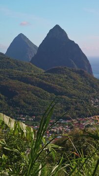Vertical Scenic View of The Pitons in St Lucia: Tropical Mountain Peaks and Soufriere Town Landscape for Social Media
