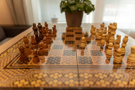 Midgame Tension Wooden Chessboard Potted Plant, Dynamic Arrangement Of Pieces, Aggressive Pawns And Knights, Competitive Atmosphere, Strategic Focus