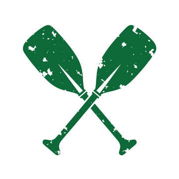 Green distressed oars crossed over each other paddles