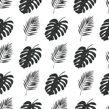 tropical monstera and palm leaves seamless pattern
