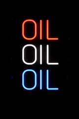 Oil Neon Sign in Red White and Blue on Dark Background