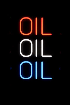 Oil Neon Sign in Red White and Blue on Dark Background