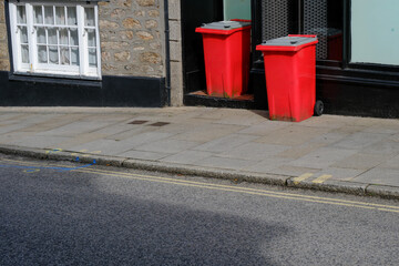 Obraz premium Bins out for collection in a quiet village street in the UK