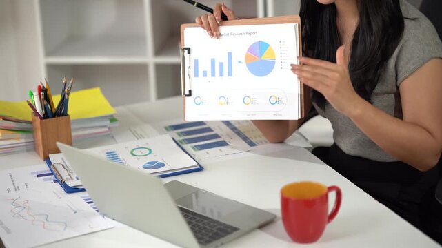 Business financing accounting banking concept. Business woman hand doing finances and calculate on desk about cost at home office. Woman working on desk with using calculator, finance accounting.