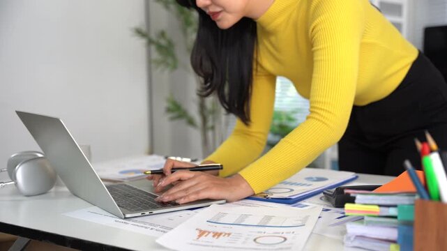 Business financing accounting banking concept. Business woman hand doing finances and calculate on desk about cost at home office. Woman working on desk with using calculator, finance accounting.