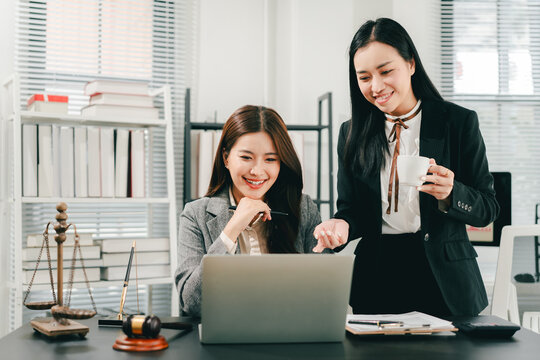 A female lawyer who trains and mentors new employees at the law firm.