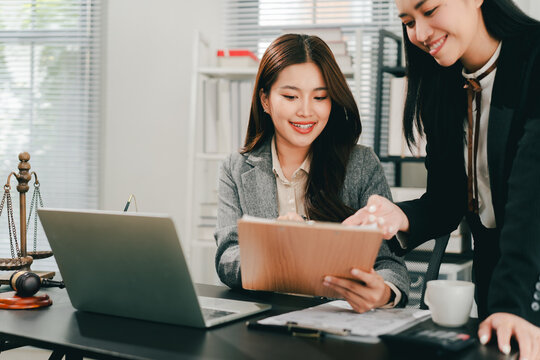 A female lawyer who trains and mentors new employees at the law firm.