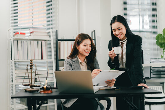 A female lawyer who trains and mentors new employees at the law firm.