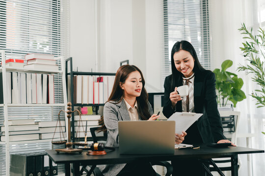 A female lawyer who trains and mentors new employees at the law firm.