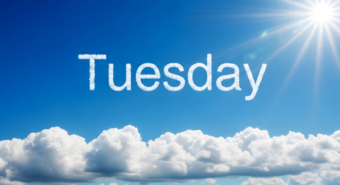 White clouds form the word Tuesday against a bright blue sky with sun rays image