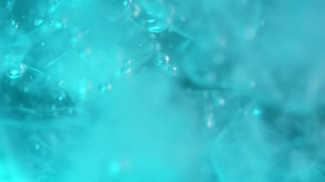 A blurred, defocused background with ice cubes underwater with oxygen bubbles, frost patterns, and soft light. Concepts for beauty advertising, menu designs for bars and restaurants, cryotherapy.