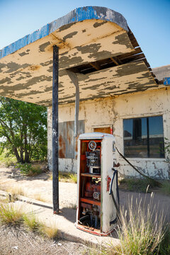 Abandoned Gas Pump at Weathered Roadside Station