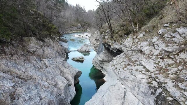 Aerial drone footage tilting from top down view of Soča river canyon to scenic alpine landscape in Slovenia