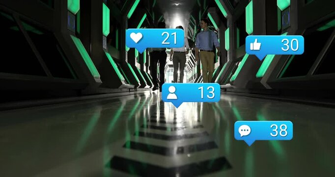 Team of three walking toward camera in tech tunnel, driving animated like or comment bubbles peaking