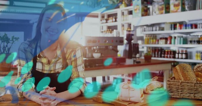 Barista at counter, animated overlay sweeping across woman and wraps, showing numbers for cafe data