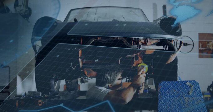 Polishing mechanic in light shirt using buffer under sports car on lift in workshop, yellow pad