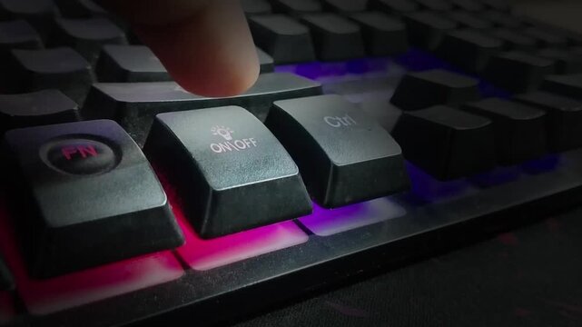 Hand on keyboard with light is toggling on and off animation. Finger pressing Light on off command on the keyboard.