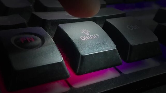 Hand on keyboard with light is toggling on and off animation. Finger pressing Light on off command on the keyboard.