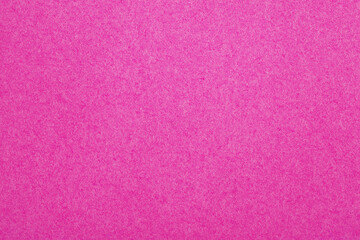 Fototapeta premium Vibrant pink textured paper background, perfect for creative designs, digital backdrops, and branding projects.