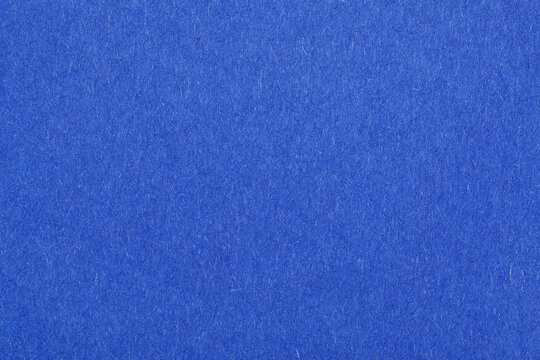 Vibrant blue felt fabric surface, seamless texture perfect for backgrounds, product displays, and creative design projects.