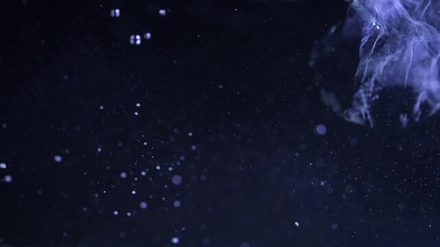 Ice cube falling into water with oxygen bubbles, frost patterns, and soft light reflections. Concepts for beauty advertising, menu designs for bars and restaurants, cryotherapy.