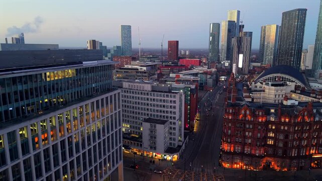 Aerial video over St Peter's Square in Manchester at dawn. 