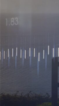 Animating bluish bars and orange waveform over sea through glass pane with numbers, dark post