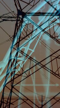 Vertical video: Camera panning cyan overlay sweeping beams and hex across tower for power audit