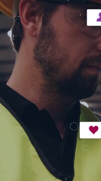 Vertical video: Factory worker in PPE turning head as alert icons sliding in, checking bell counter
