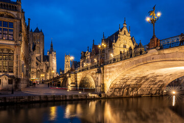 Fototapeta premium Night view of Ghent with St. Michael's Bridge and medieval towers, Belgium.
