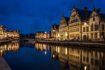 Obraz premium Night view of historic guild houses on Graslei quay in Ghent, Belgium.