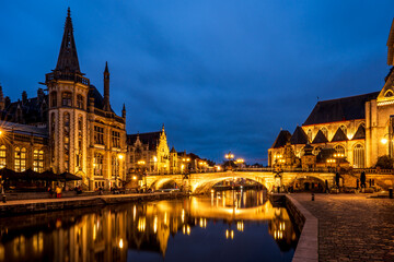 Fototapeta premium Night view of Ghent with Saint Michael's Bridge and the old post office, Belgium.