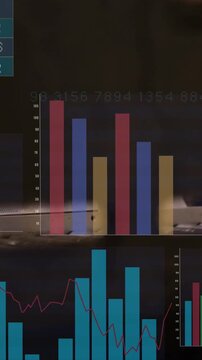 Displaying translucent dashboard over factory machinery at bay, showing teal numeric table