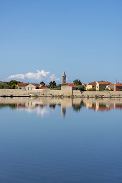 Panoramic view of medieval City walls and bell tower of 6th century St. Anselm&rsquo;s Church, Nin, Croatia, Dalmatia