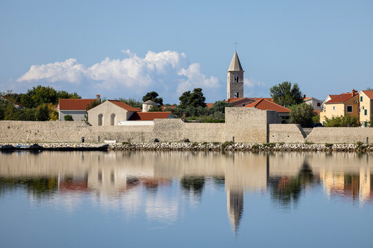 Panoramic view of medieval City walls and bell tower of 6th century St. Anselm&rsquo;s Church, Nin, Croatia, Dalmatia