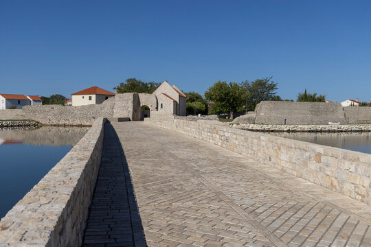 Stone Upper Stone Bridge leading to Upper Gate (Gornja vrata), entrance to medieval old city, Nin, Croatia, Dalmatia