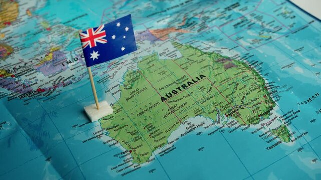 Flag of Australia placed on map highlighting land of kangaroos and Great Barrier Reef