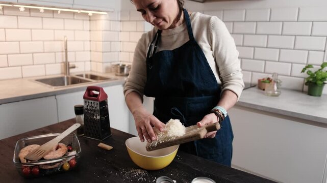Girl Chef Grating Hard Parmesan Cheese And Then Sprinkling The Grated Cheese For Sauce Preparation